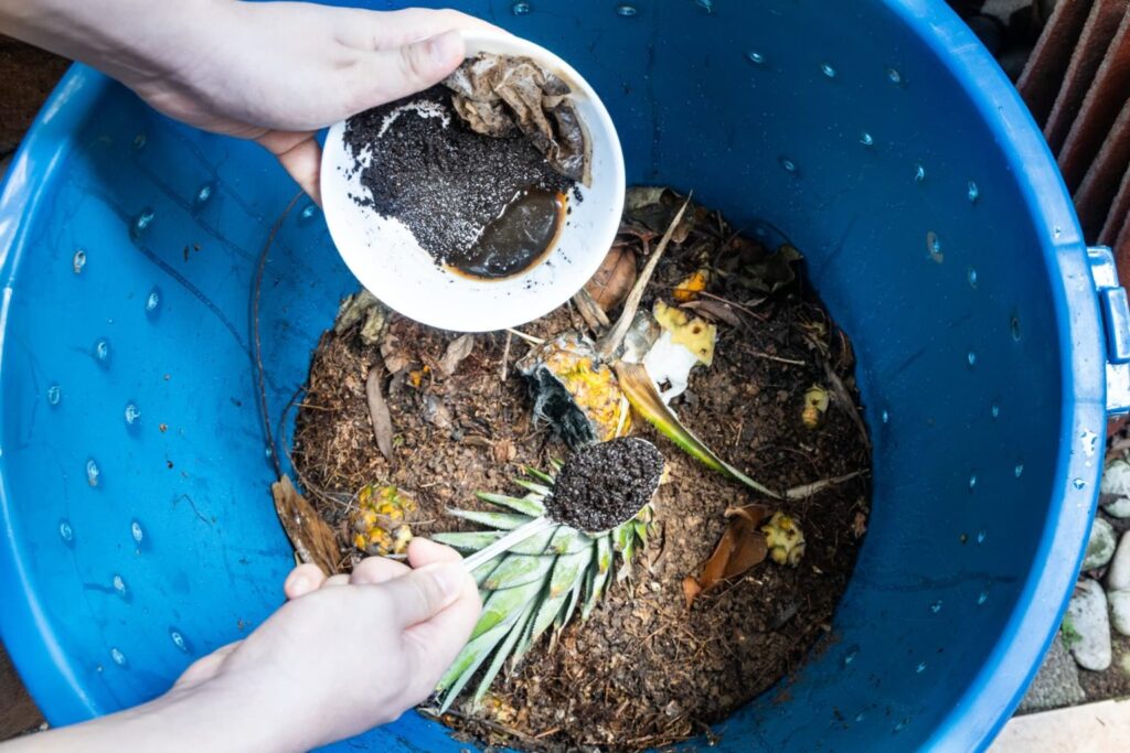 Used coffee grounds added to compost