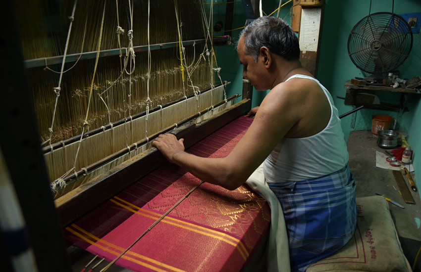 Man Weaving Saree