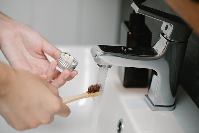 Using less water while brushing